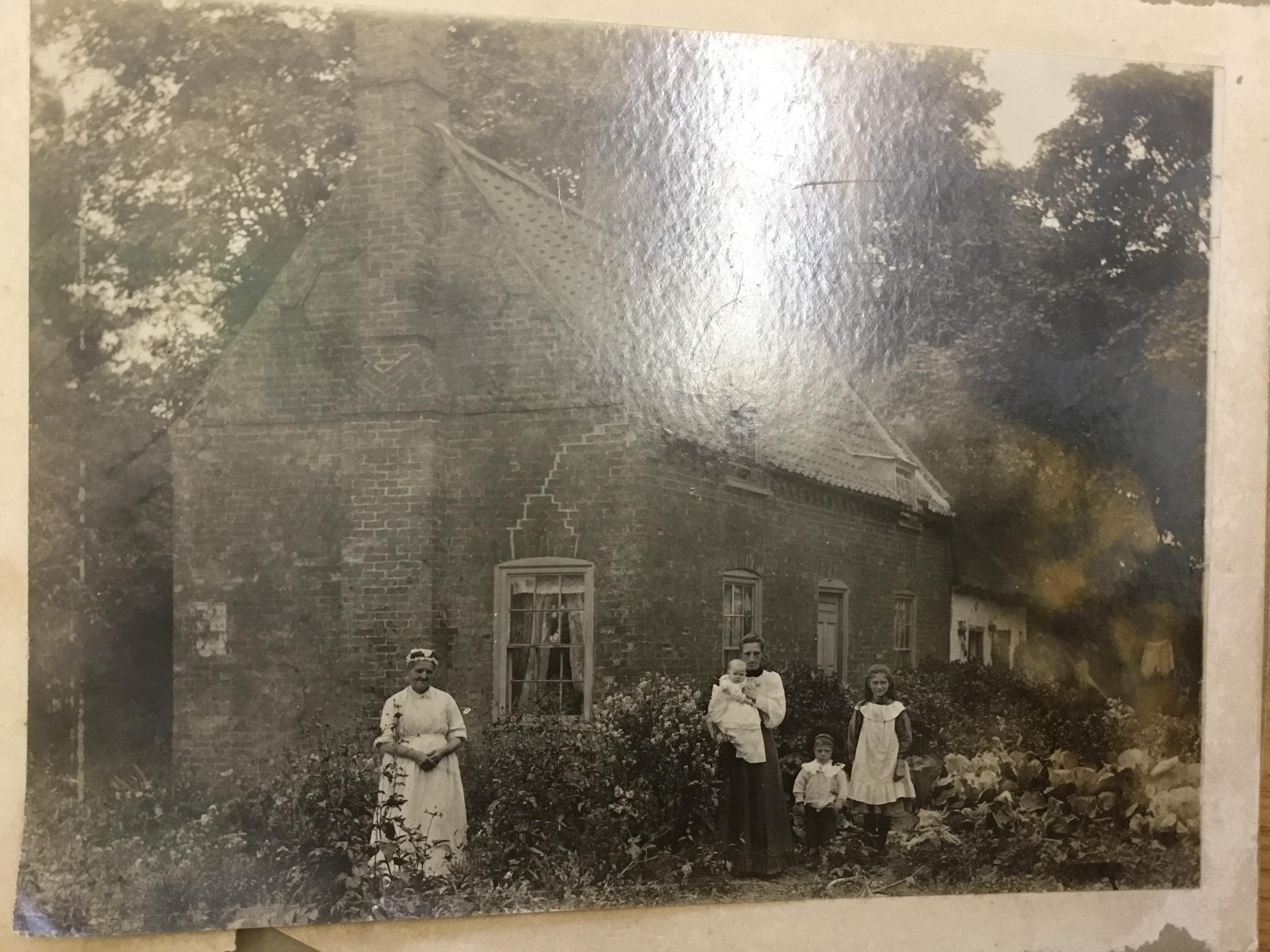 Residents outside their house in East Keal, probably Victorian times